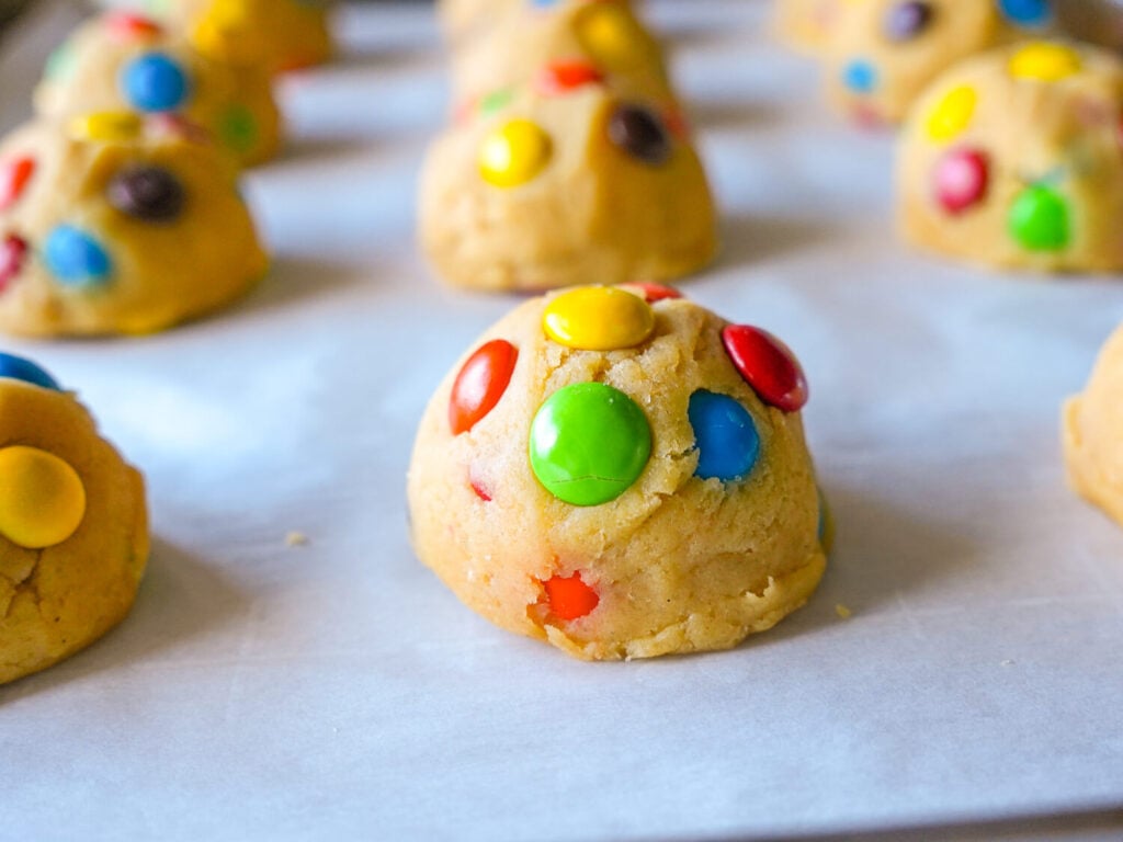 Close up photo of an M&M cookie dough ball