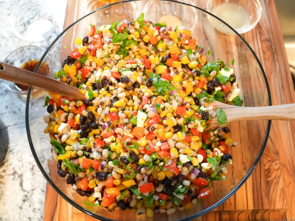 Overhead photo of Black Eyed Pea Salad on a wooden cutting board