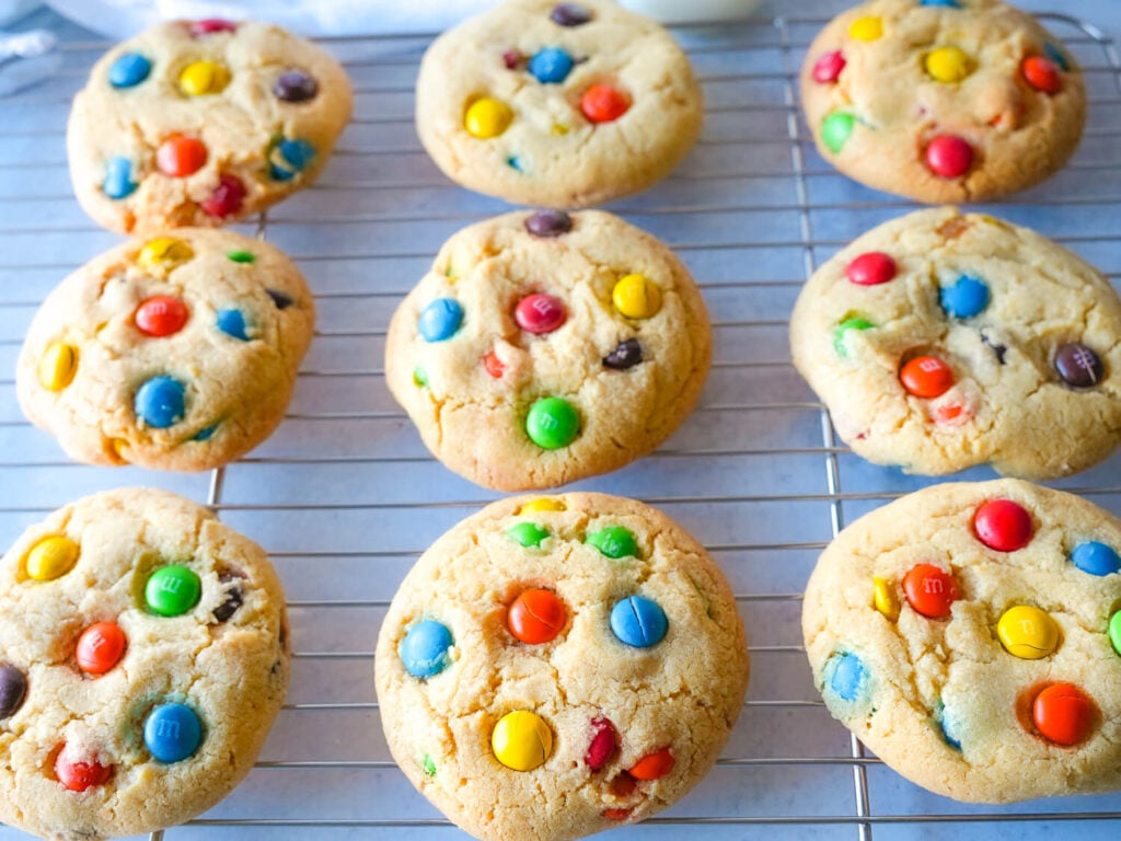 Overhead photo of M&M cookies on a wire rack