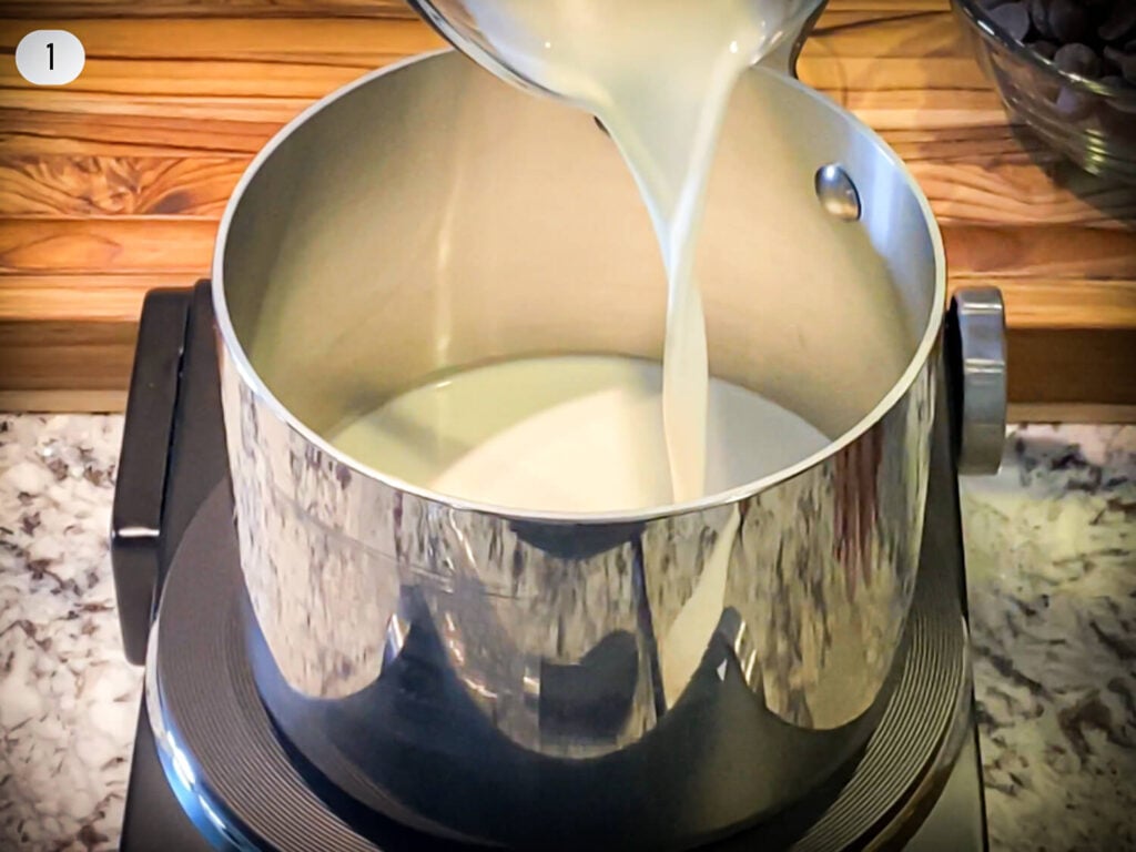 Step 1 photo of heavy cream being poured into a sauce pan