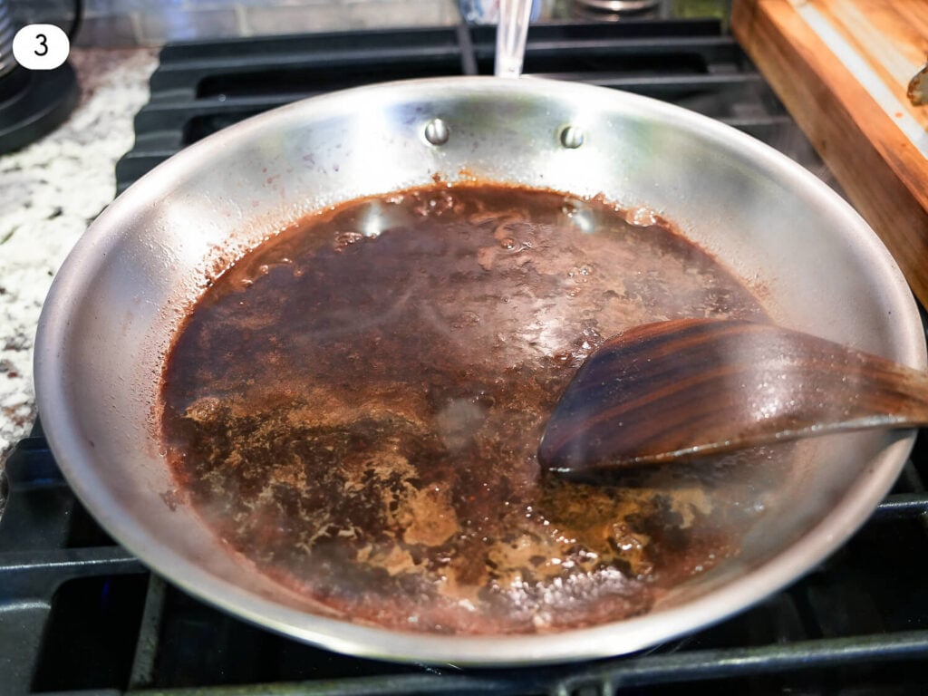 Step 3 photo of deglazing the pan with red wine