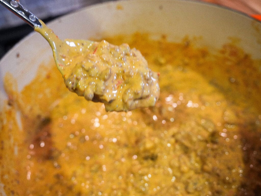 close up photo of Sausage Cheese Dip on a spoon