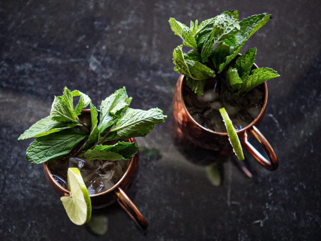 overhead photo of two Kentucky Mules garnished with mint and lime