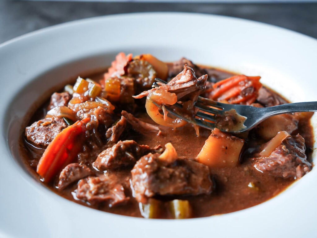 photo of Slow Cooker Beef Stew being picked up by a fork