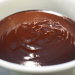 side view photo of glossy chocolate fondue