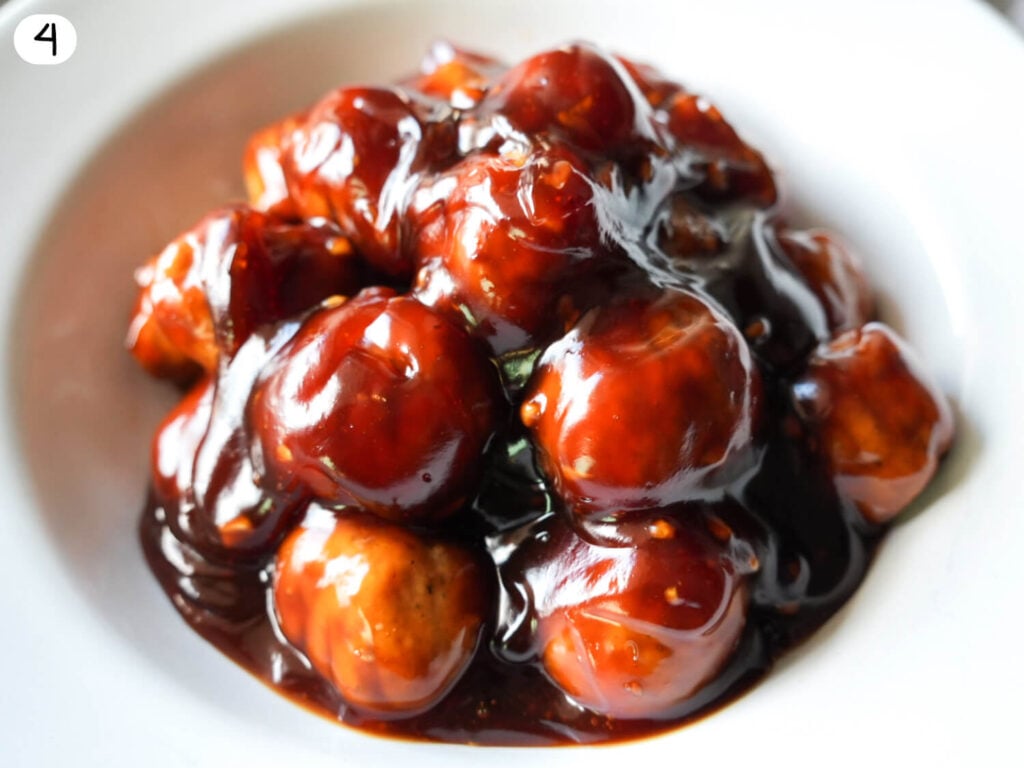 step 4 photo of Honey Garlic Meatballs in a white bowl