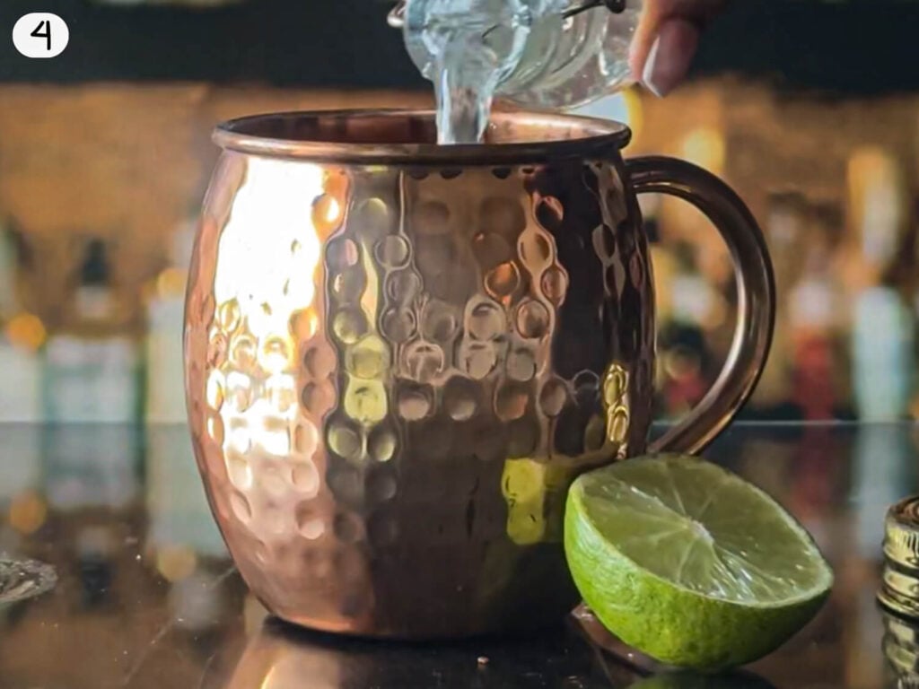 step 4 photo of pouring ginger beer into a copper mug