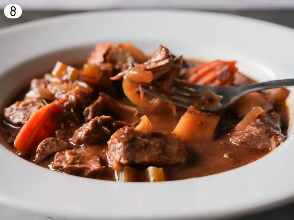 step eight photo of cooked Slow Cooker Beef Stew in a white bowl