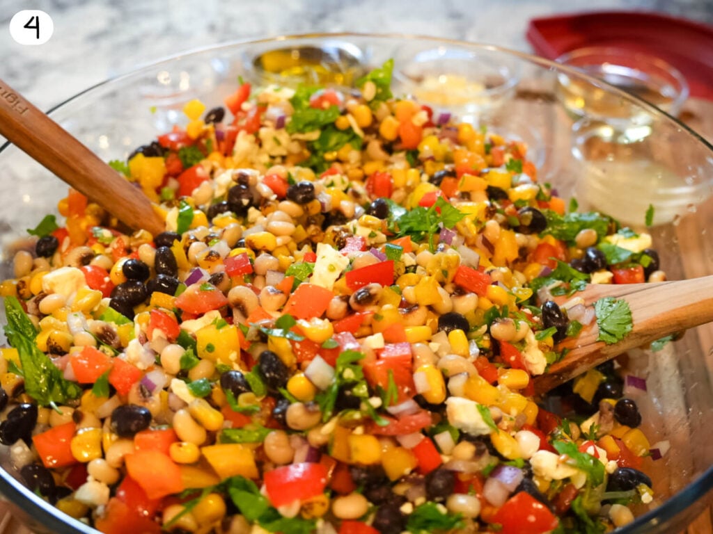 step four photo of showing salad ingredients tossed in homemade dressing