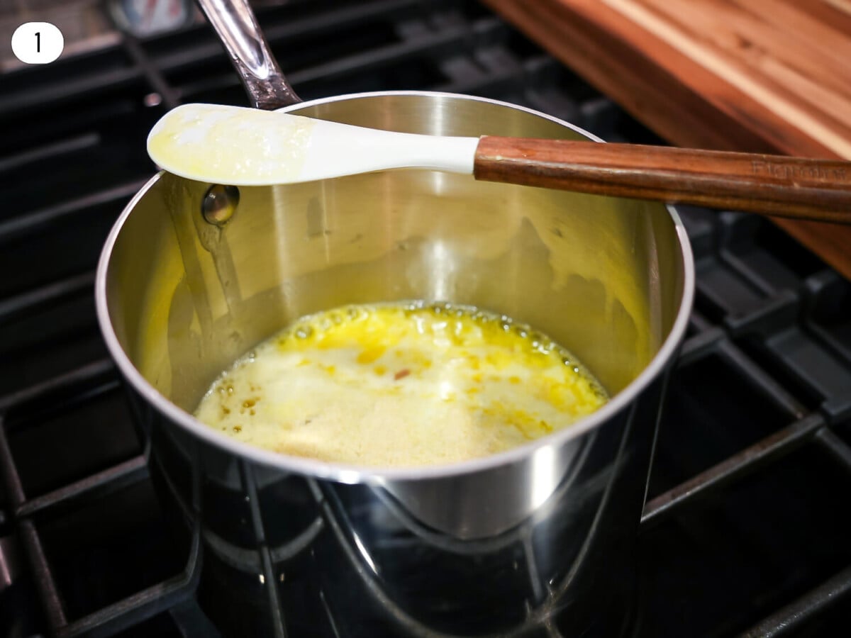 step one Photo of melted butter in a sauce pan