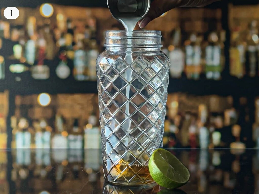 step one photo of pouring lime juice into a cocktail shaker