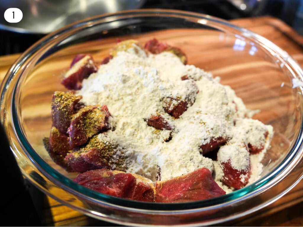 step one photo of seasoned beef meat and flour