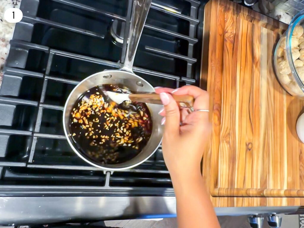 step one photo of warming Honey Garlic Meatball ingredients in a sauce pan