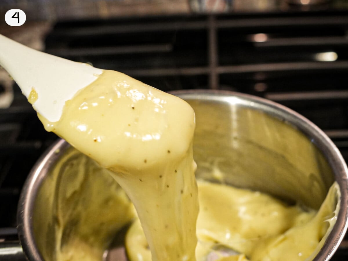 step photo of melted cheese on a spatula