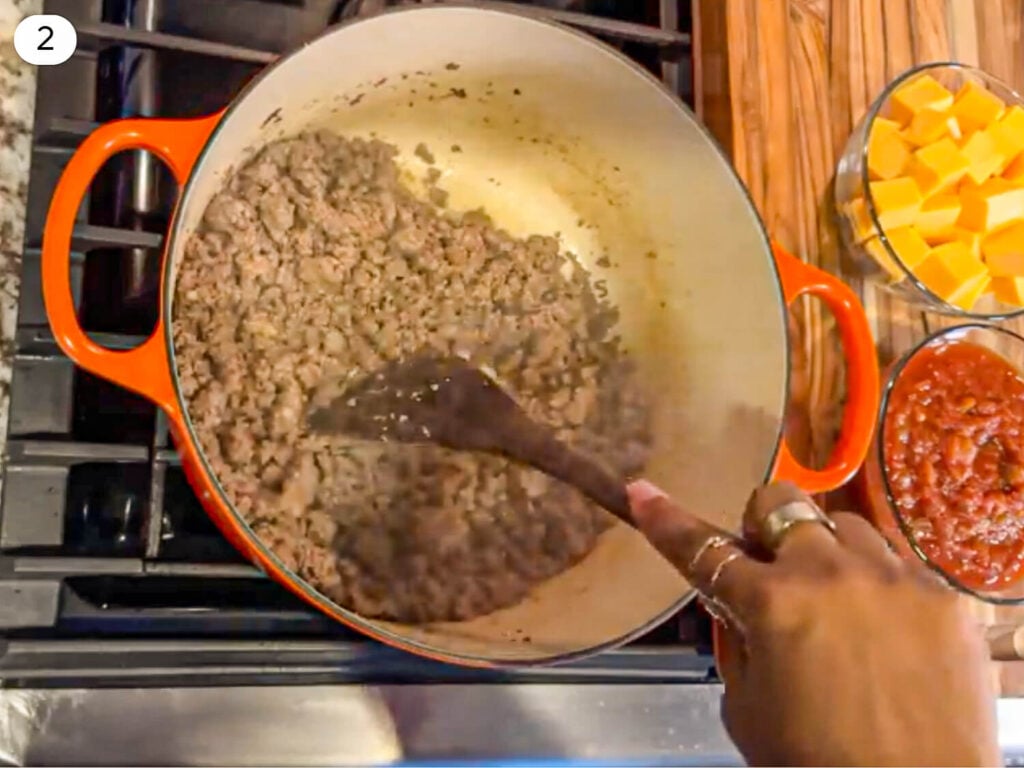 step two photo of ground beef and ground pork browning together in a pot