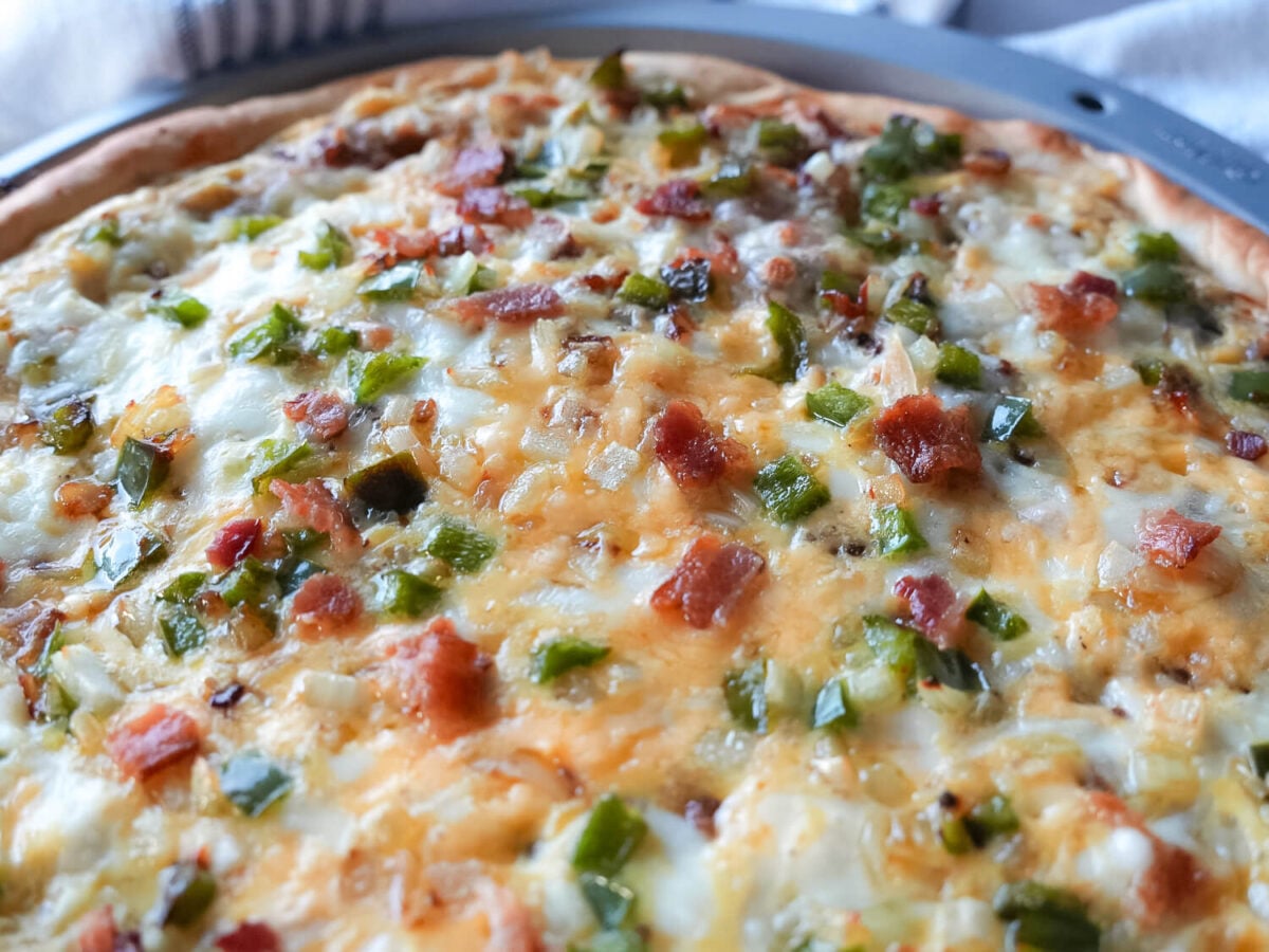 Close up photo of breakfast pizza in a pan
