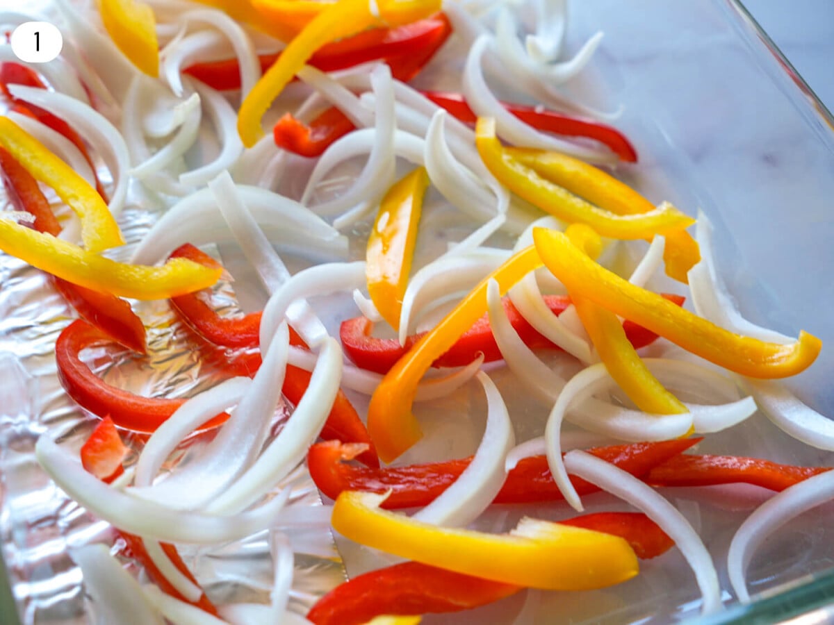 Close up photo of sliced peppers and onions