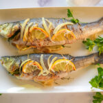 HERO photo of Roasted Branzino on a white plate