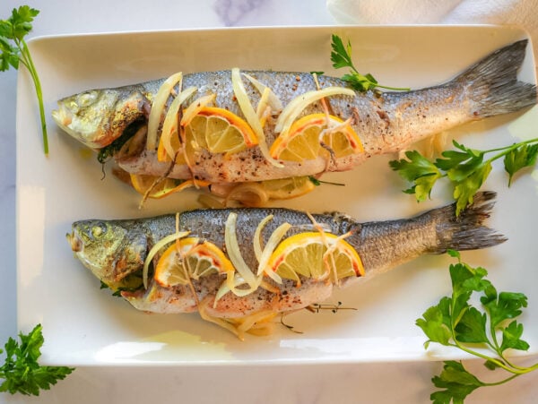 HERO photo of Roasted Branzino on a white plate