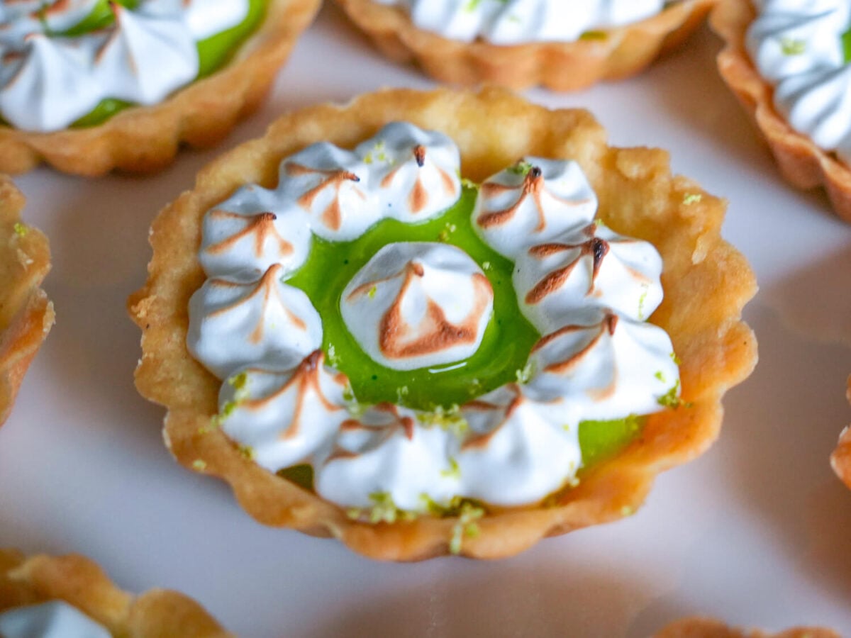 close up photo of key lime tart that was bruleed
