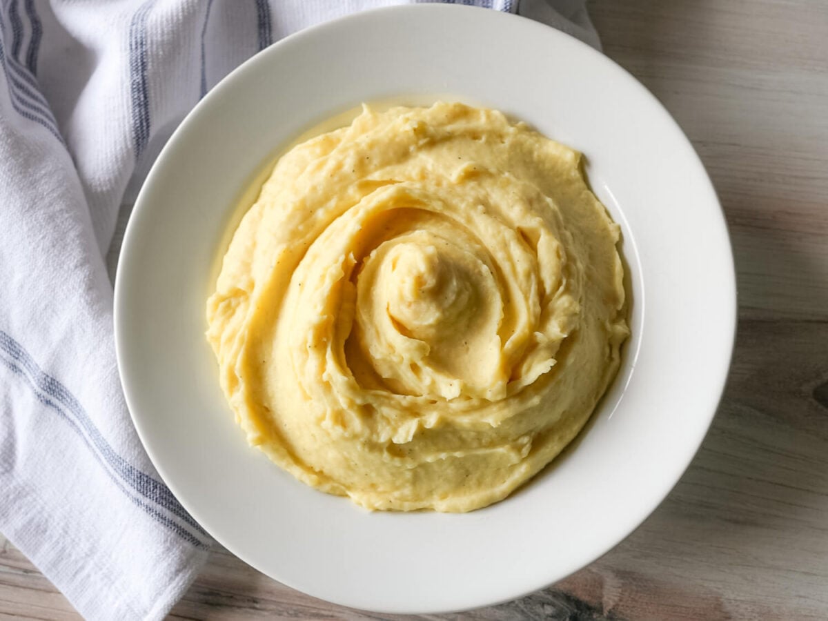 overhead photo of Garlic Mashed Potatoes in a white bowl