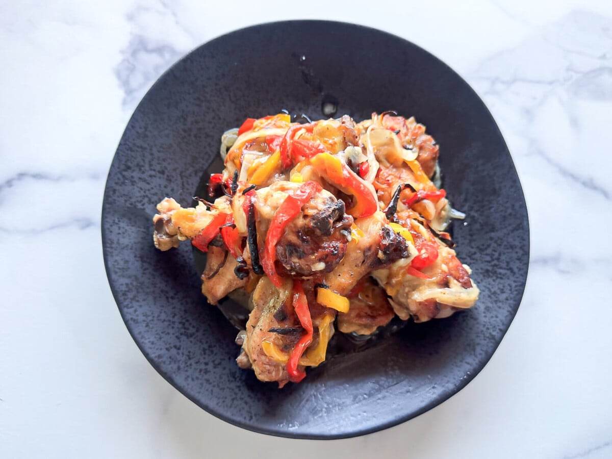 overhead photo of Italian Dressing Chicken on a black plate