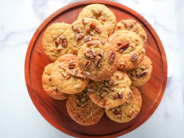 overhead photo of banana nut muffins on a wooden tray