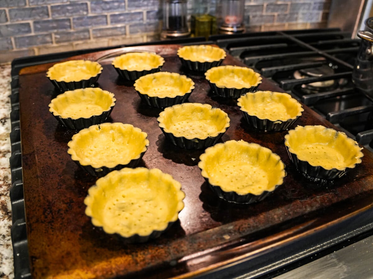 photo of Pâte Sucrée in mini tart pans before they go in the oven