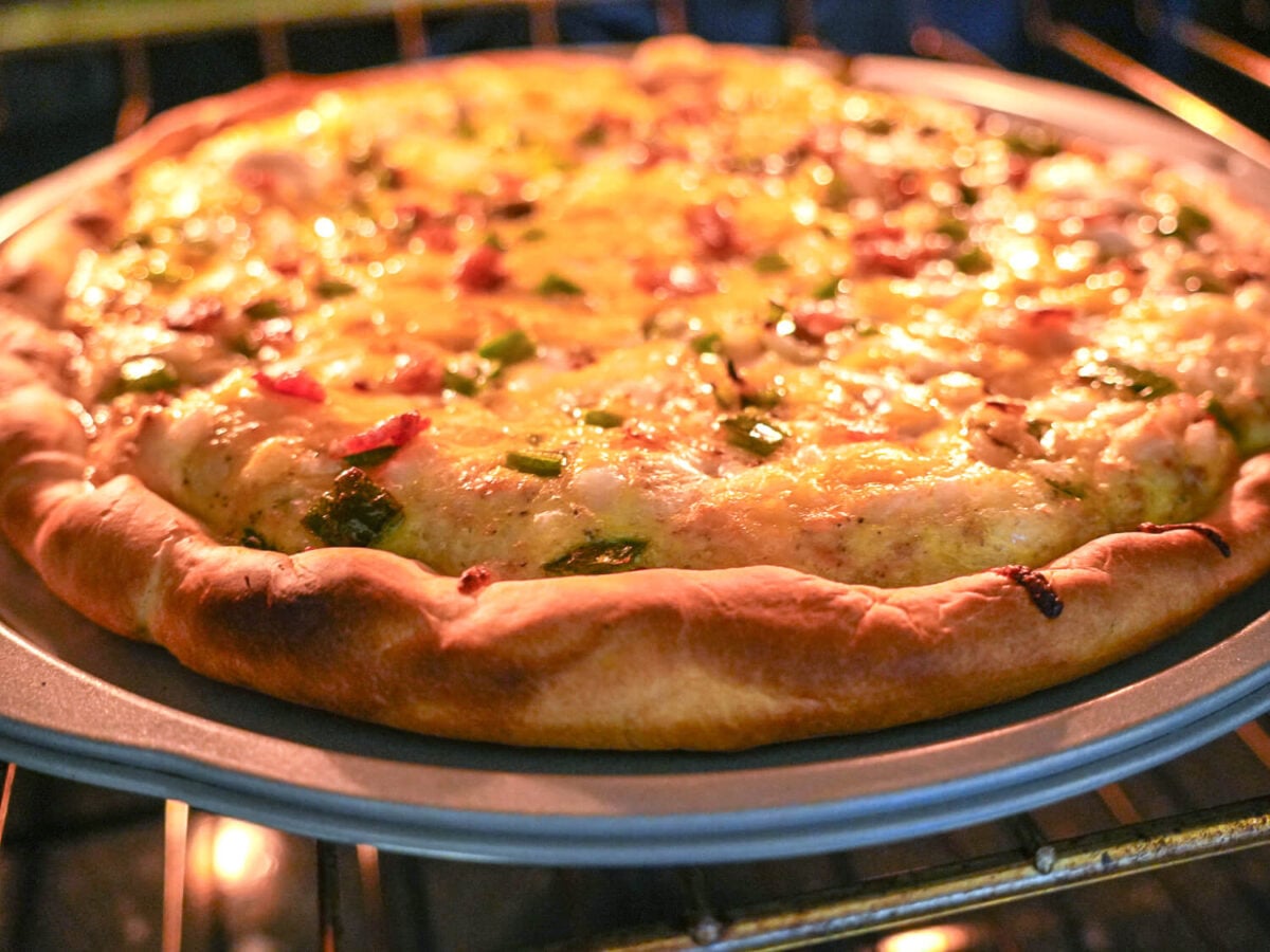 photo of breakfast pizza baking in the oven