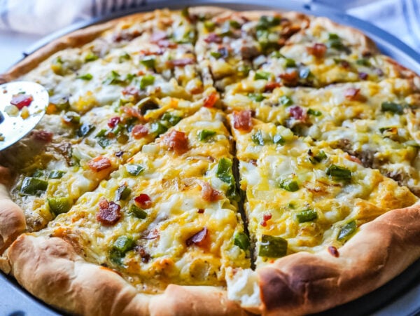 photo of breakfast pizza that's cuts into eight slices