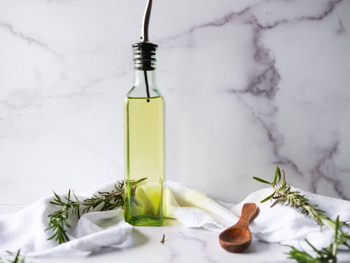 photo of good quality olive oil on a marble background