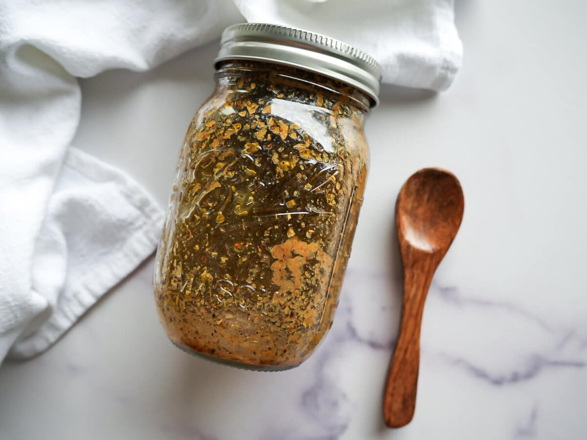 photo of greek salad dressing in a mason jar