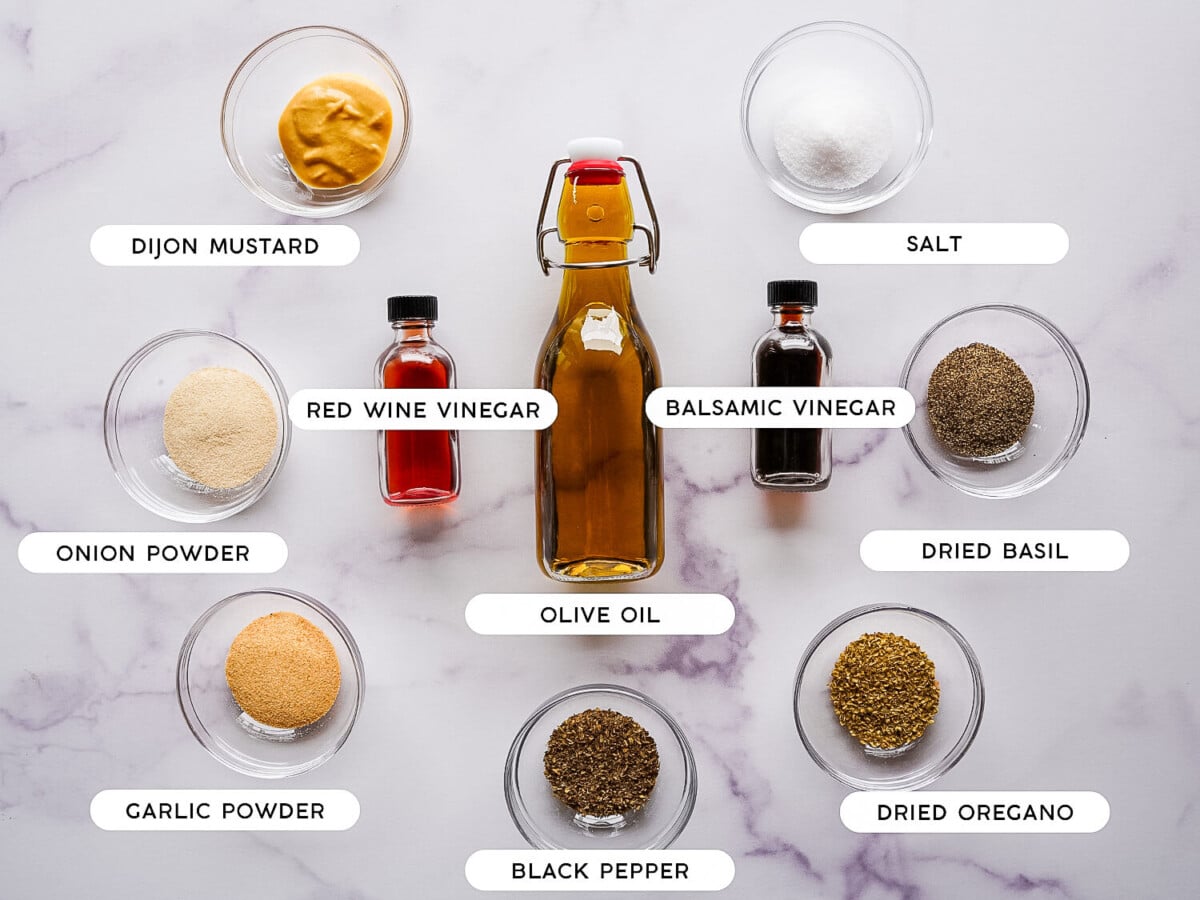 photo of ingredients to make greek salad dressing on a marble surface