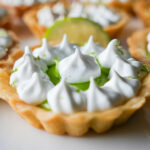 photo of key lime tart with swiss meringue