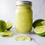 photo of lime curd in a mason jar on a marble surface