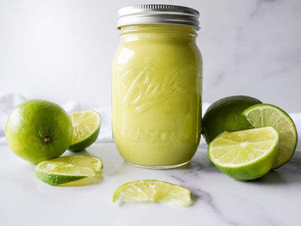 photo of lime curd in a mason jar on a marble surface