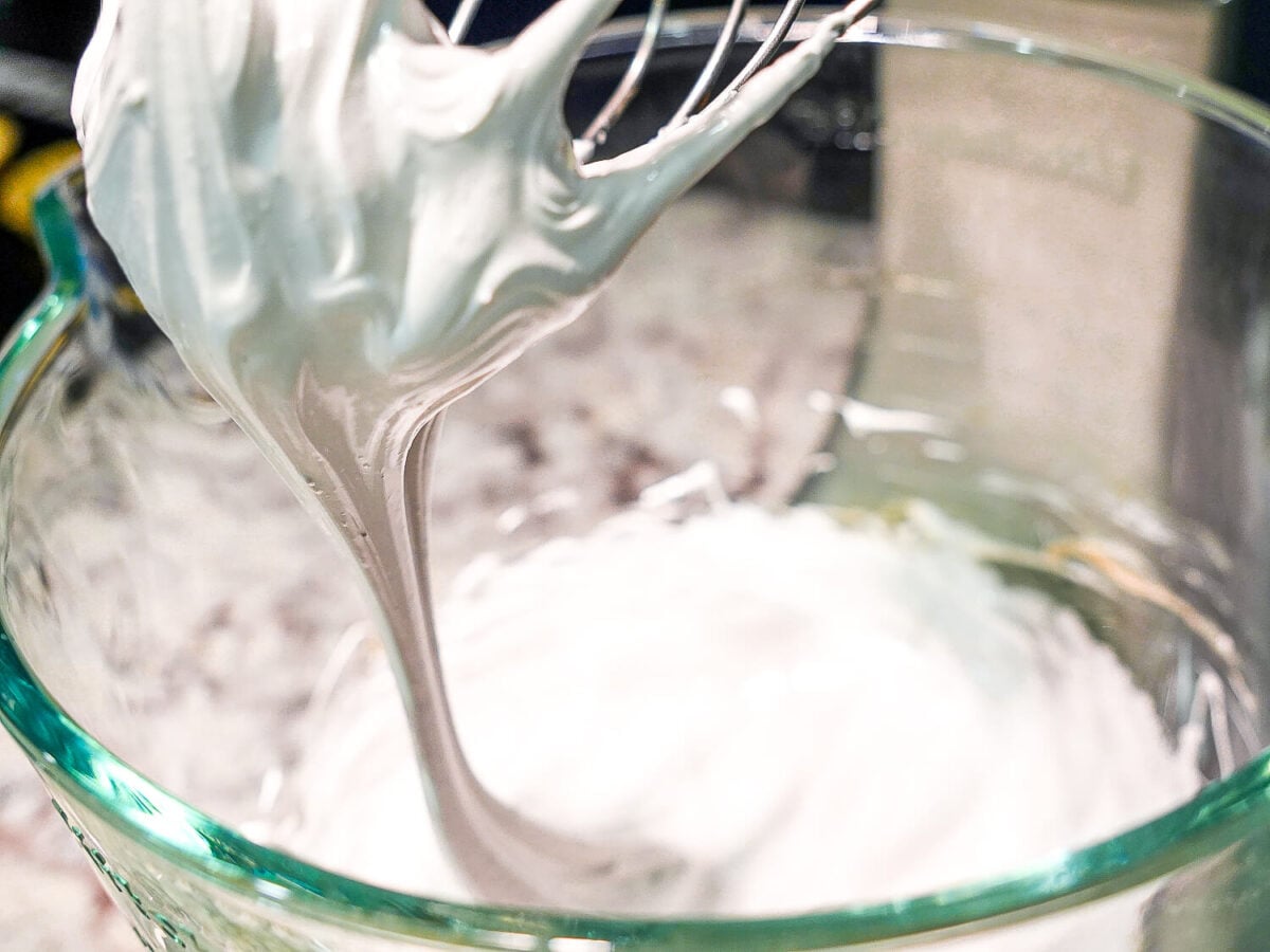 photo of stiff Swiss Meringue on a whisk