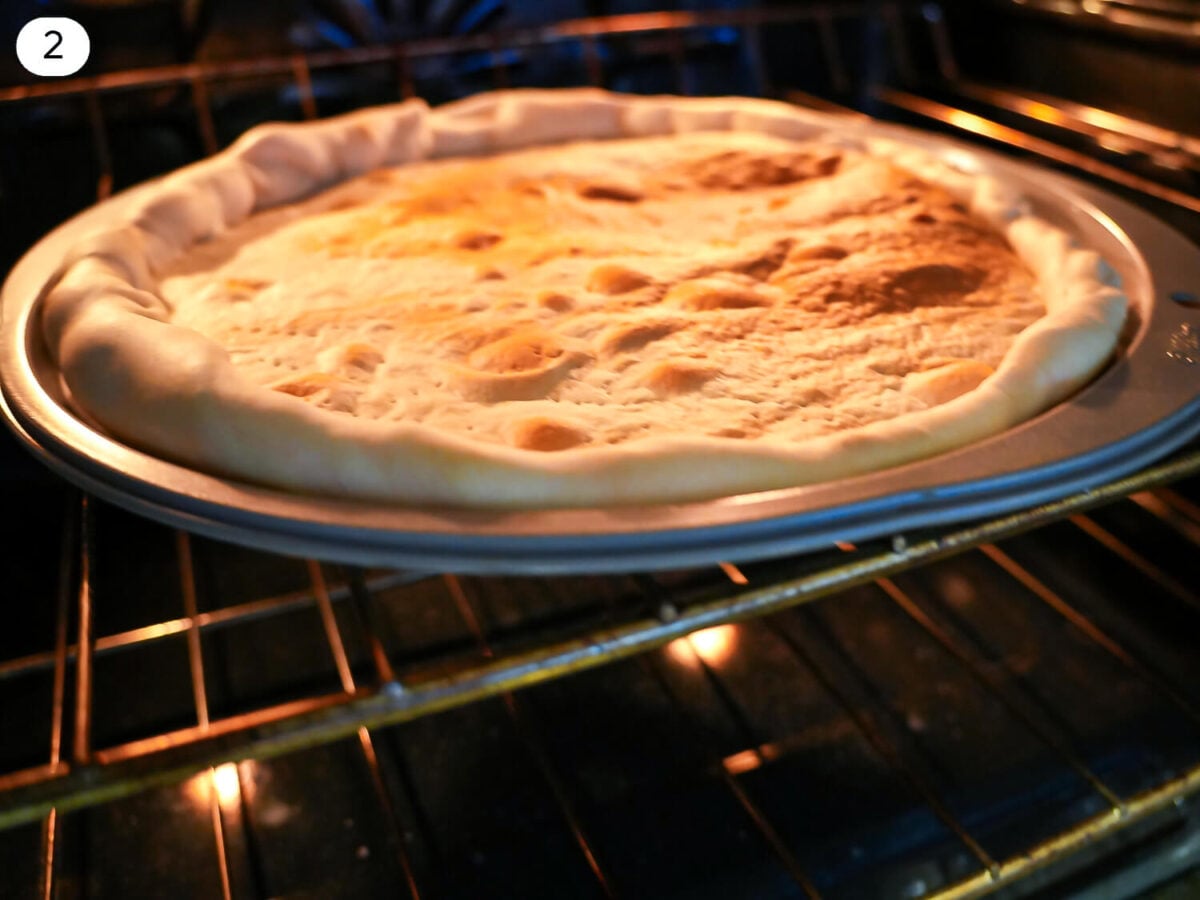 step 2 photo of pizza crust baking in the oven