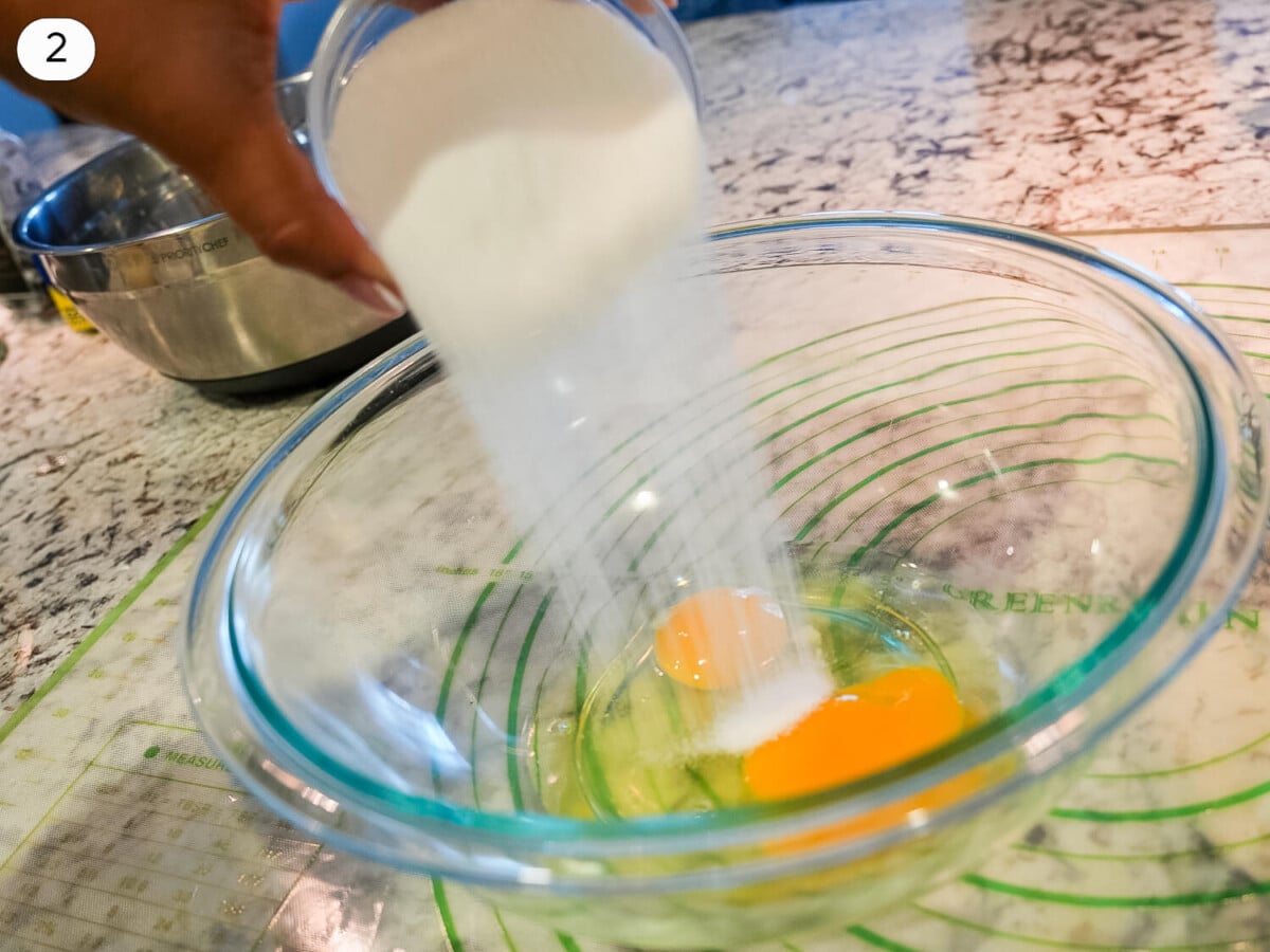 step 2 photo of sugar being added to eggs