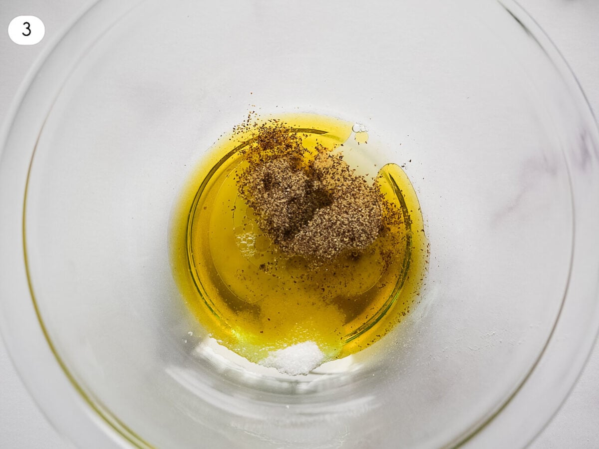 step 3 photo of salad dressing in a bowl with olive oil and seasonings