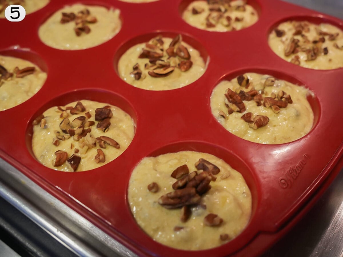 step 5 photo of filling muffin tins with banana nut batter