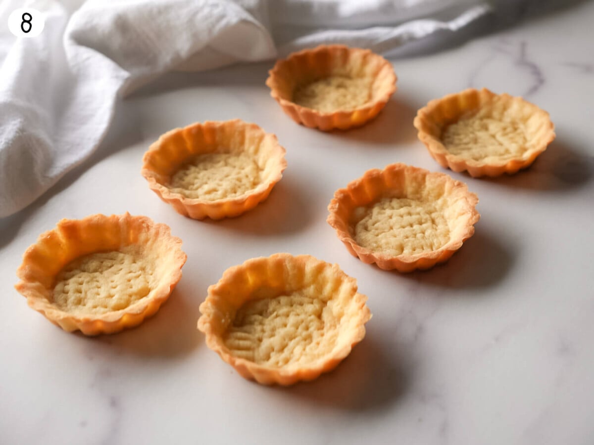 step 8 photo of removing tarts while warm