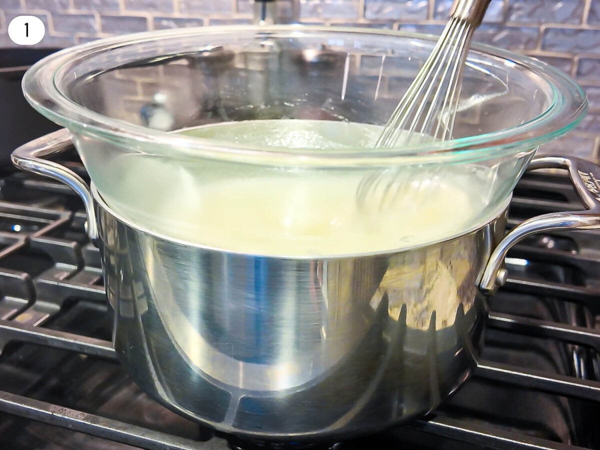 step one photo of double boiler setup where a glass bowl is on top of a cooking pot