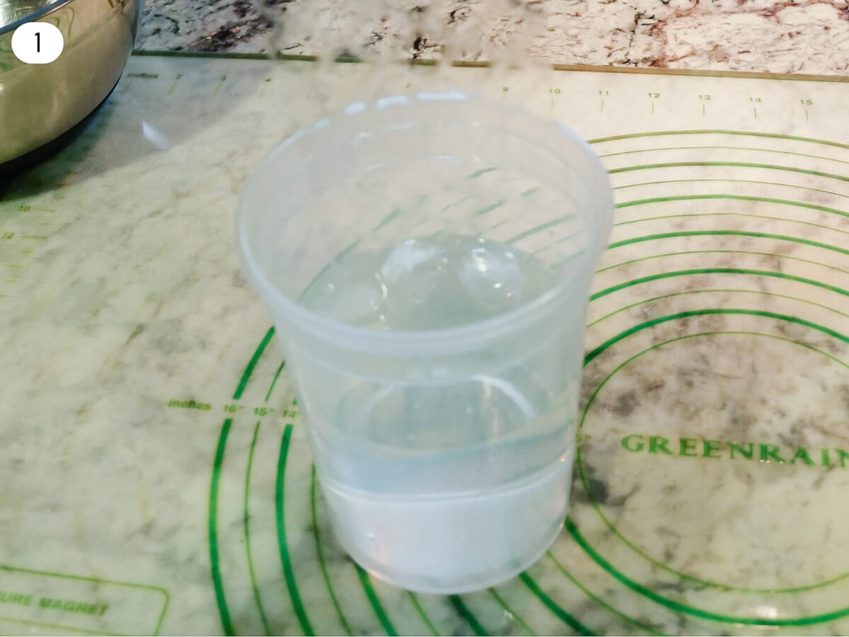 step one photo of gelatin in a bowl of water