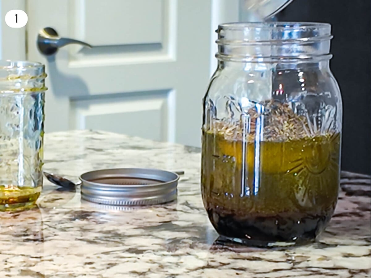 step one photo of greek salad dressing ingredients being added to a mason jar