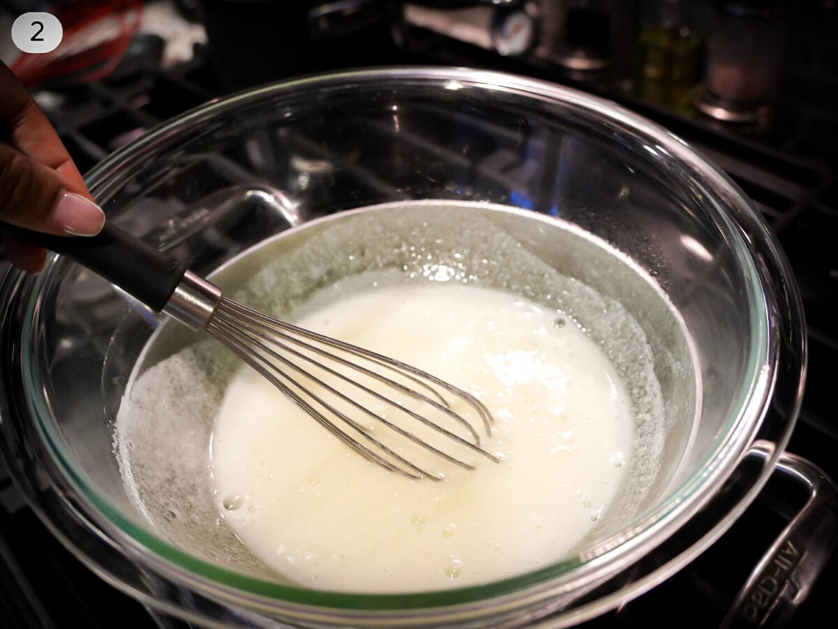 step two photo of egg whites and sugar in a double boiler