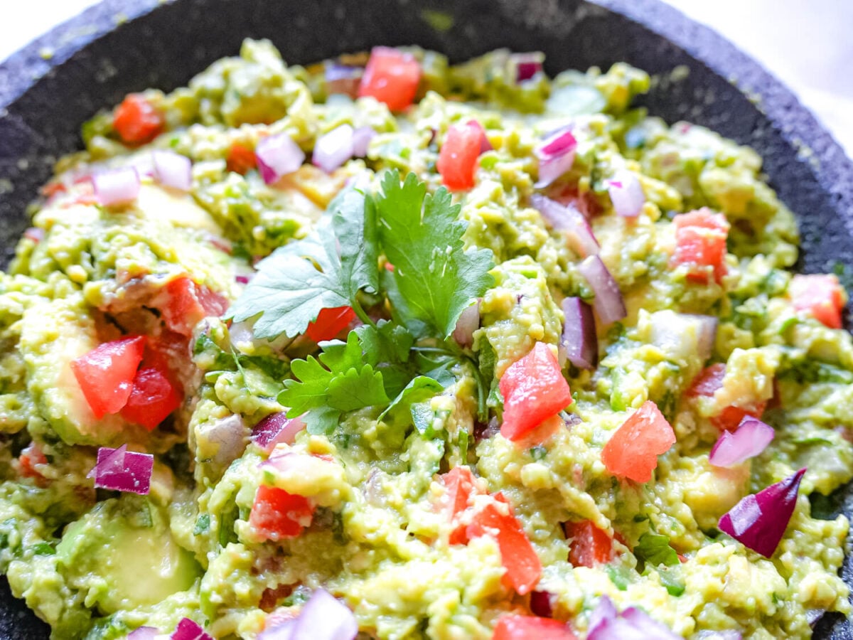 close up photo of Guacamole and cilantro