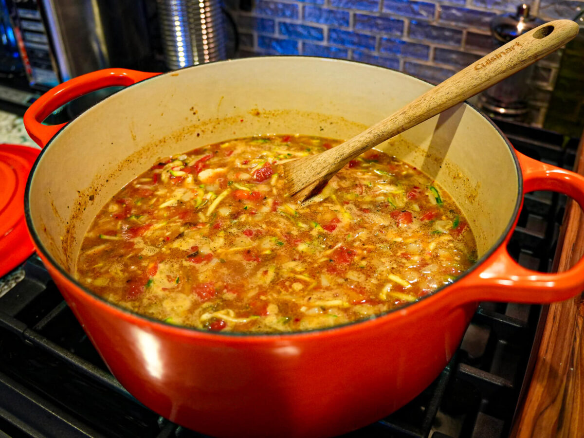 photo of chicken chili in an orange dutch oven