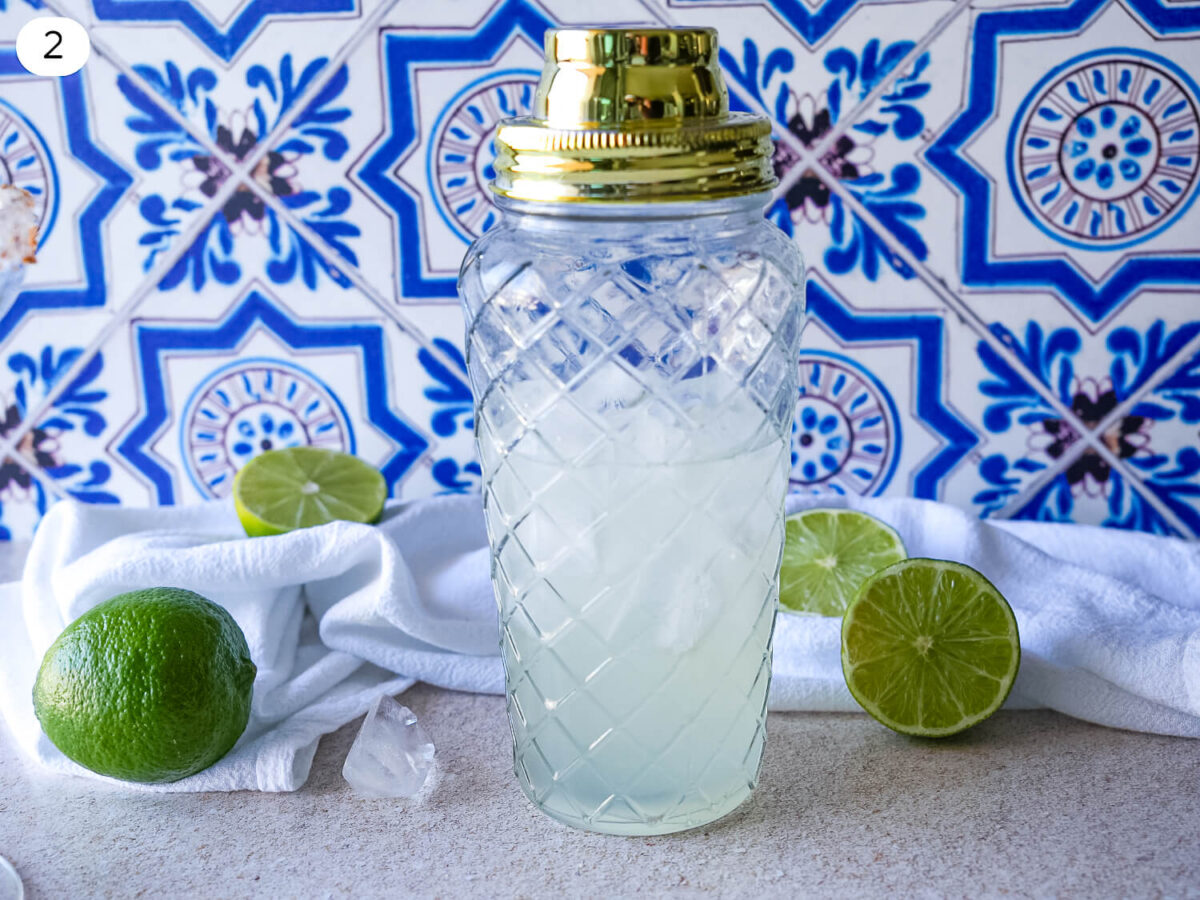 step two photo of ice in a shaker before its poured in a glass