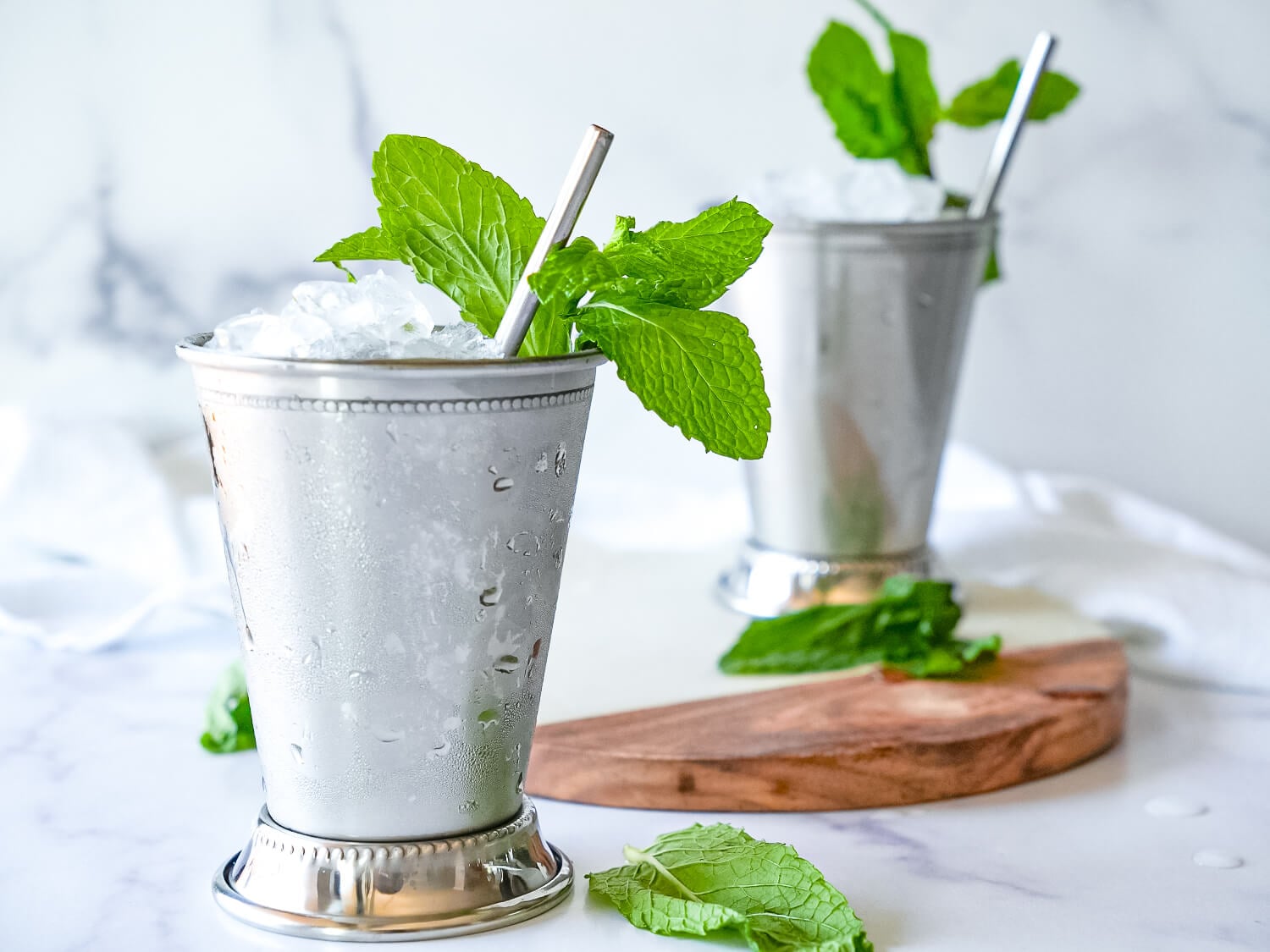 HERO photo of 2 Mint Juleps on a marble surface